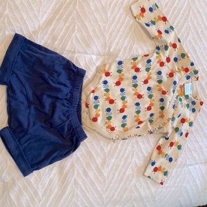Hanna Andersson caterpillar onesie with navy shorts